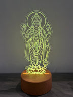 Satyanarayana 3D lamp glowing yellow-green showing wooden LED base with touch button