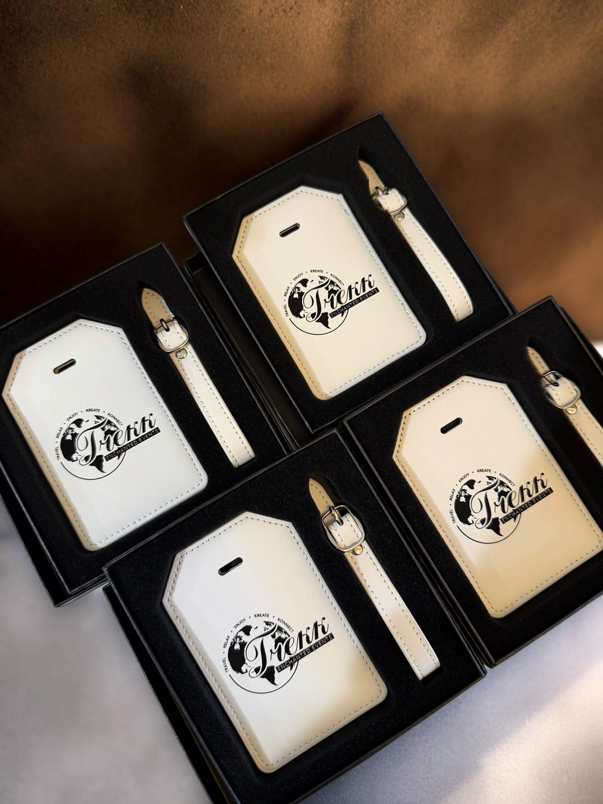 Set of personalized white luggage tags in gift boxes with custom engraving