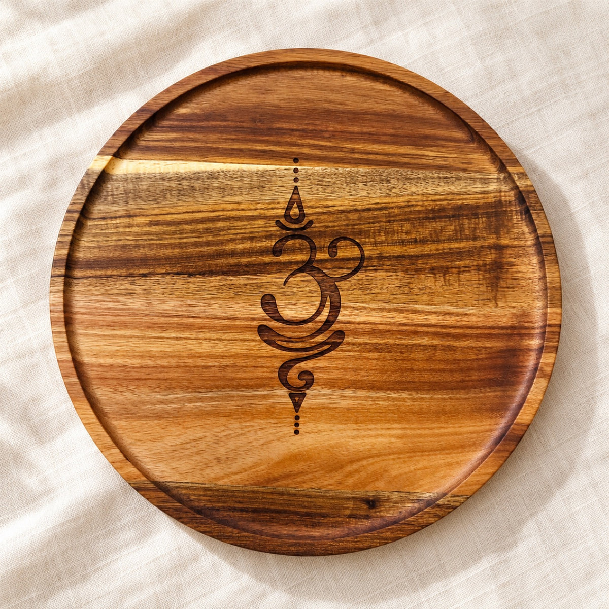 Round 12-inch wooden pooja tray with laser-engraved Om symbol – natural wood grain by RA Kreations