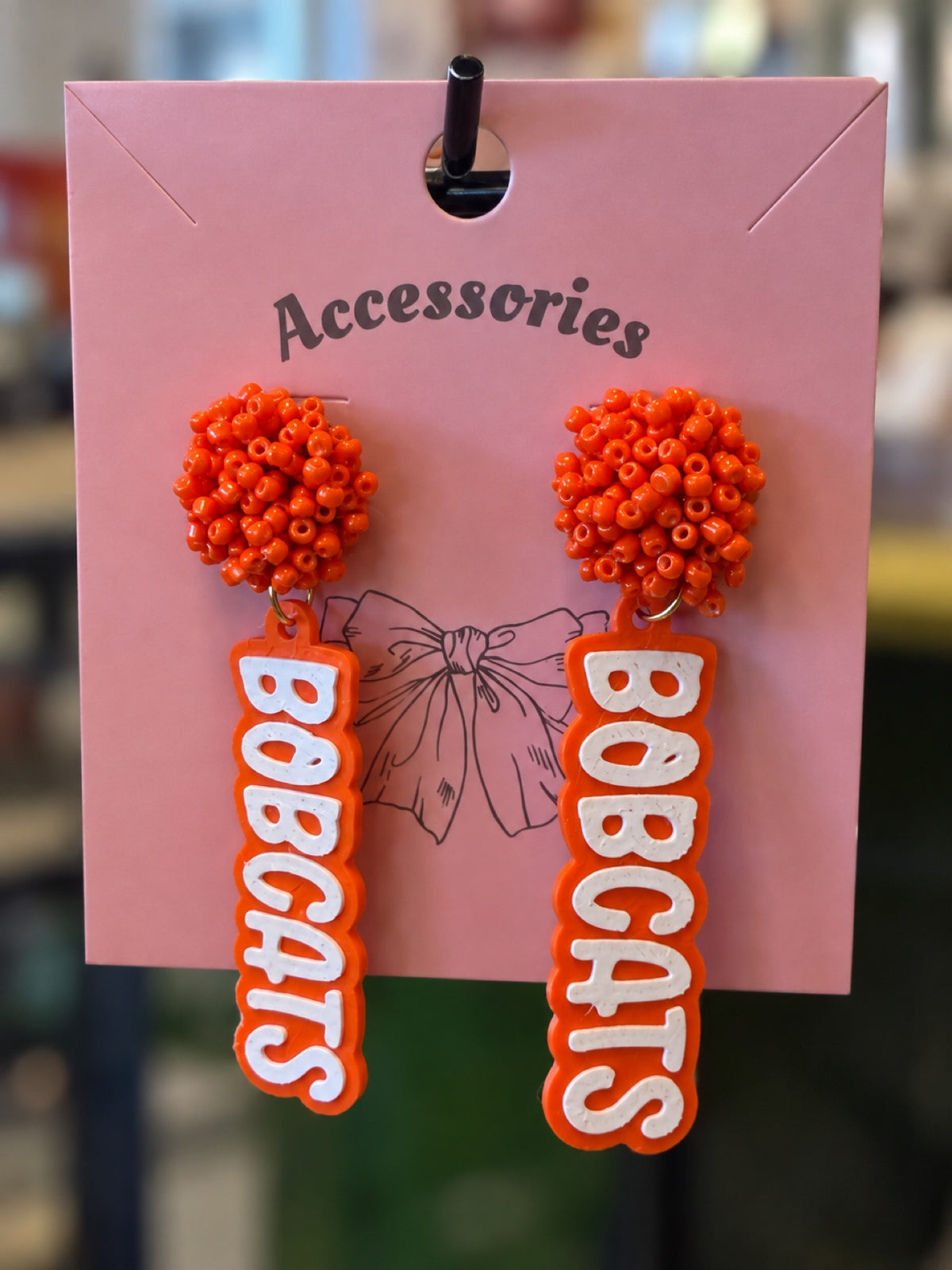 BOBCATS bead dangle earrings with orange seed-bead clusters and vertical BOBCATS dangle