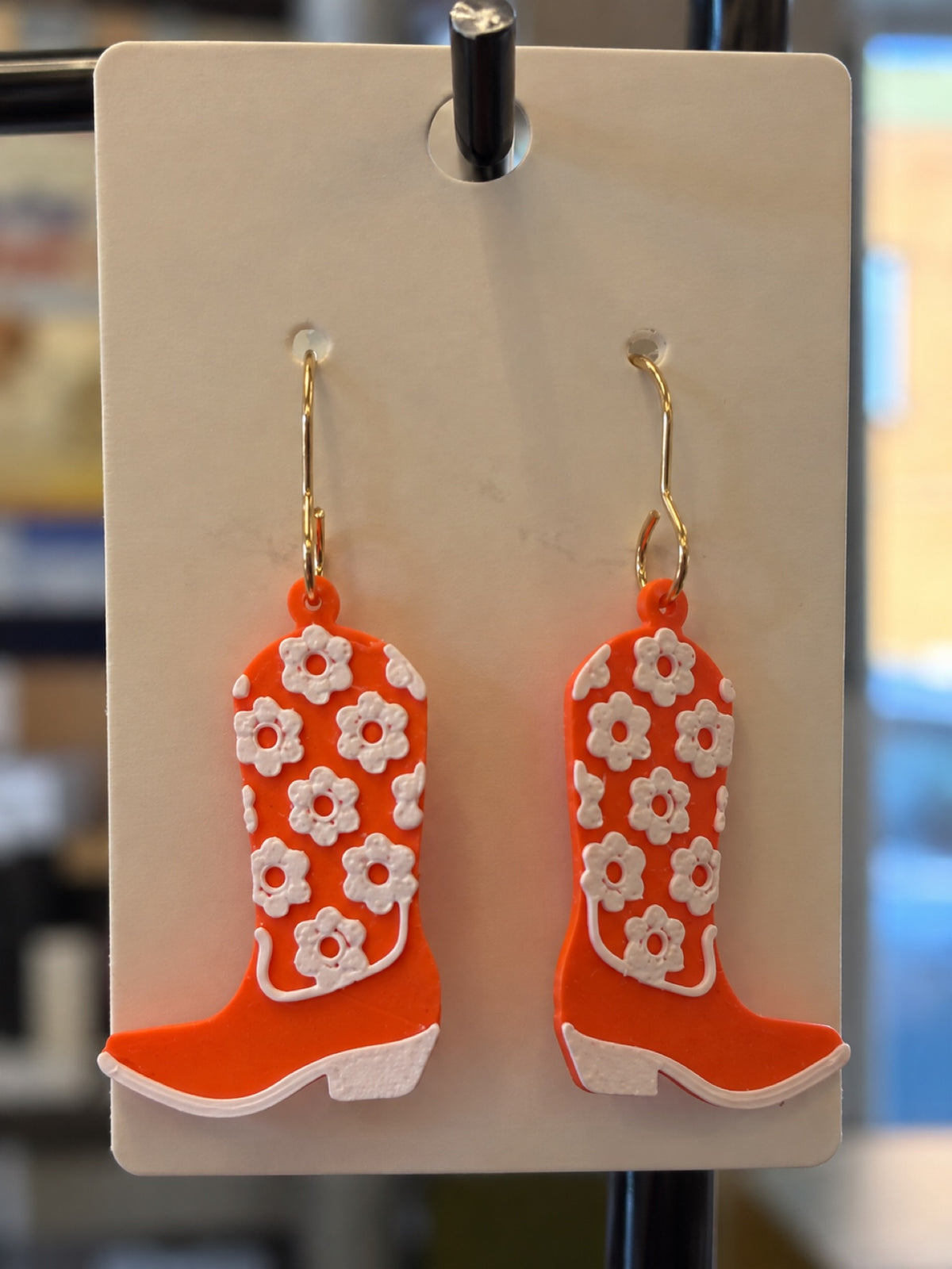 3D printed orange cowboy boot dangle earrings with white floral detail - Bobcats game day jewelry