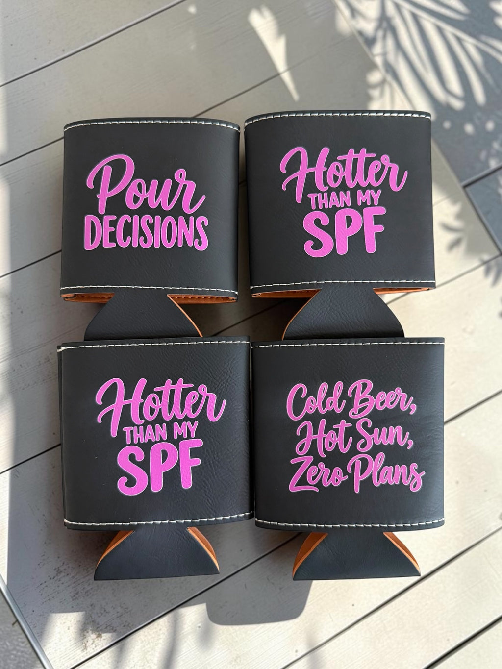 Black leatherette can coolers with pink engraved funny beer sayings
