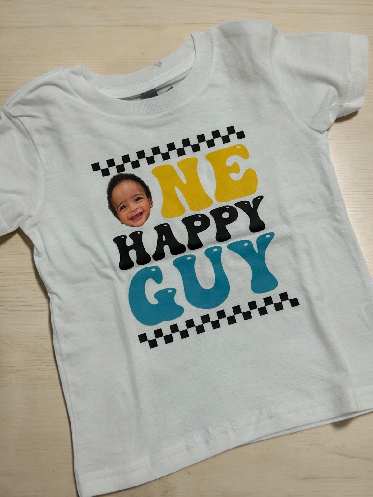 Custom white toddler DTF t-shirt with One Happy Guy first birthday photo print