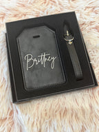 Black leatherette luggage tag engraved with the name Brittney in script font