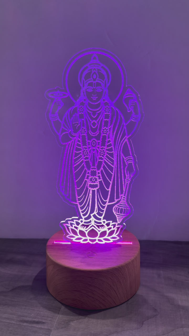 Video showing Lord Satyanarayana LED lamp changing colors - purple, pink and blue