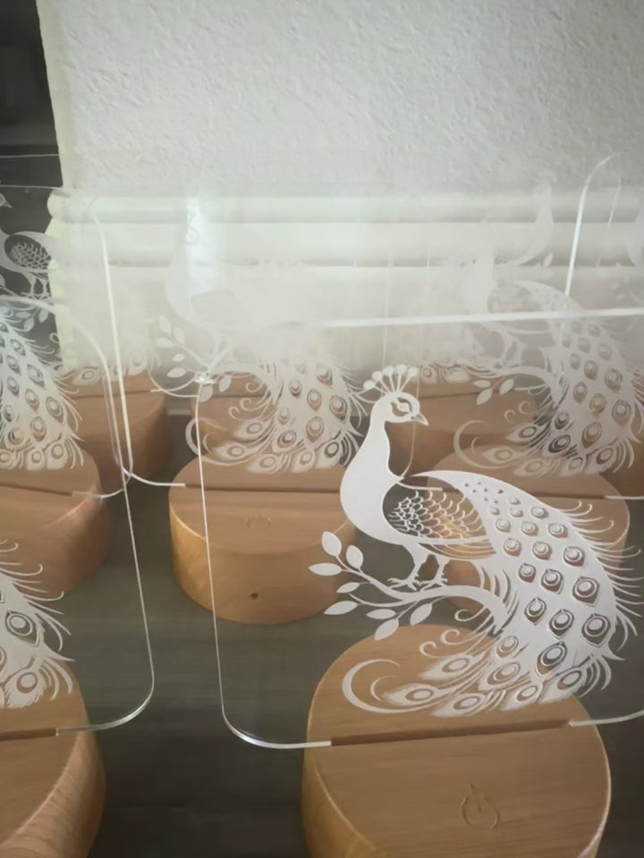 Video showing peacock LED lamp color-changing glow - 3D laser engraved acrylic night light