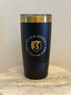 Custom black 20oz tumbler with gold laser-engraved Storm Shield Restoration Group business logo