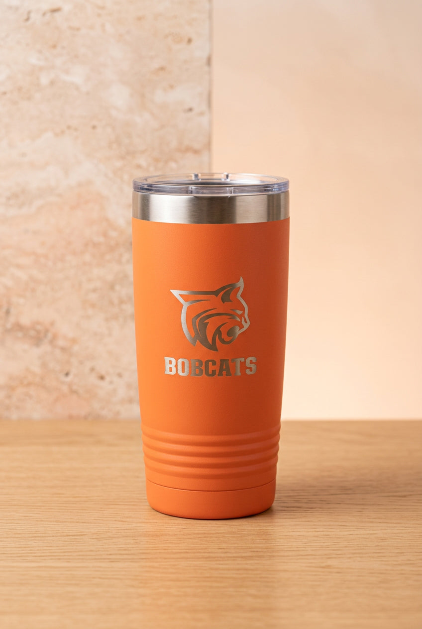 Personalized orange 20oz laser-engraved Bobcats tumbler with silver wildcat logo reveal